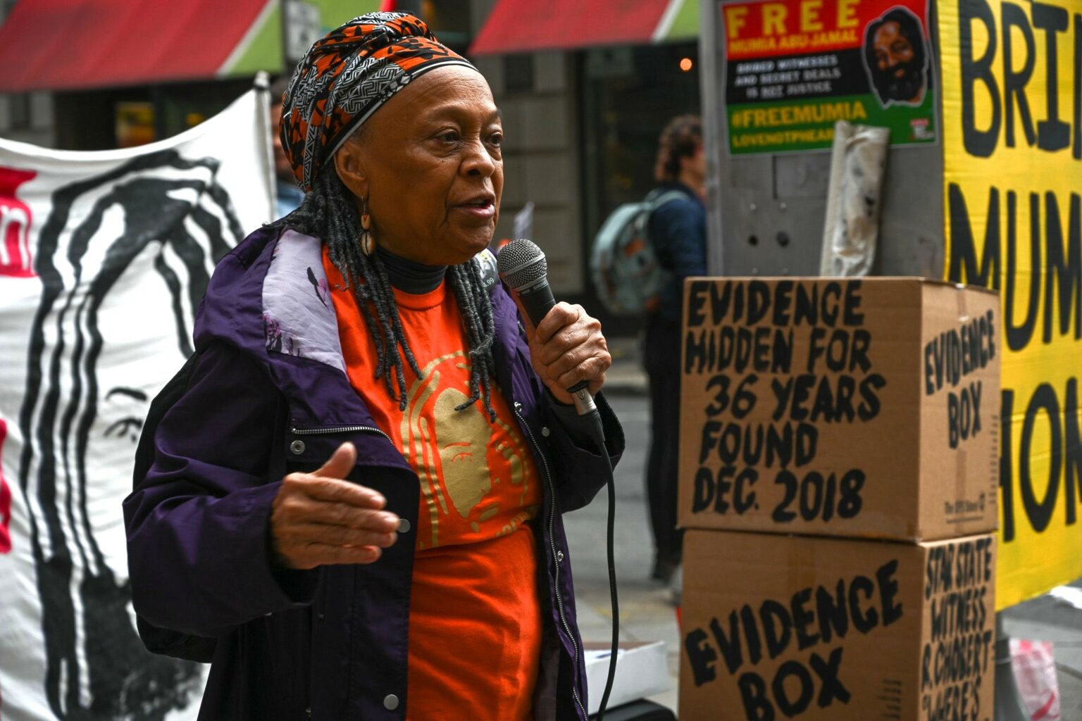 Pam Africa explains importance of the newly discovered evidence, outside court hearing in Philadelphia, Oct 26. Credit: Joe Piette