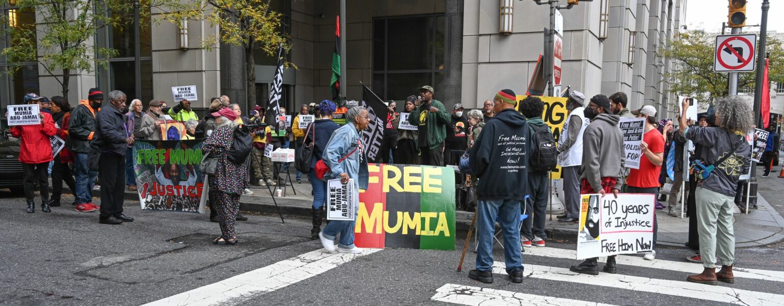 Gabe Bryant (with bullhorn) leads crowd in “Free Mumia” chants at rally, outside courthouse in Philadelphia, Oct. 26. Credit: Joe Piette